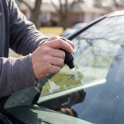 Close-up of resin being applied to a star-shaped windshield chip